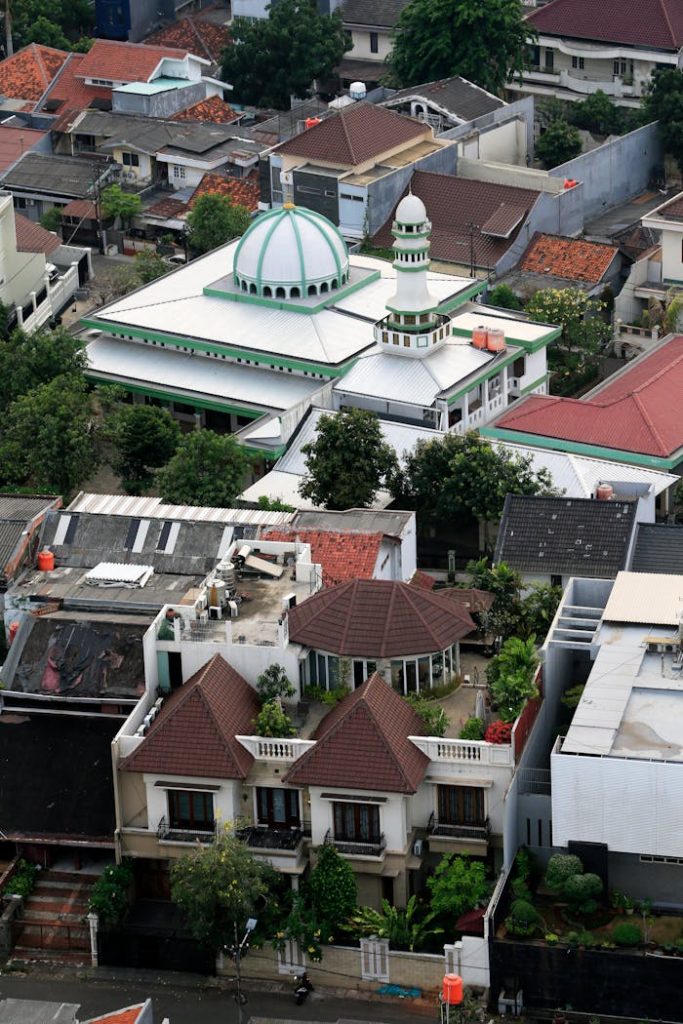 Scenic aerial shot of a neighborhood with a prominent mosque in Indonesia.